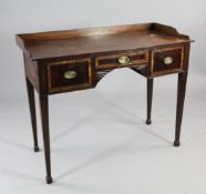 A Victorian mahogany and crossbanded kneehole desk, with three quarter gallery back over three