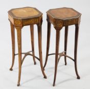 A pair of George III marquetry inlaid satinwood stands, with octagonal rosewood crossbanded tops, on