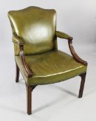 A George III mahogany Gainsborough chair, with brass studded green leather upholstery, with