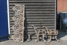 A Victorian cast iron bench, the back cast and pierced with four ovals depicting figures working,