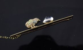 An Edwardian 15ct three colour gold and platinum `hatched chick and egg` bar brooch, with safety