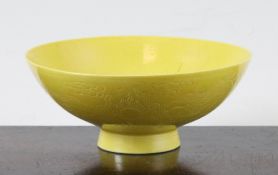 A Chinese yellow glazed `dragon` bowl, Qianlong mark, Republic period, the exterior incised with two