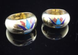 Two Egyptian 18ct gold rings, each with lotus motif inlaid with lapis lazuli, carnelian and