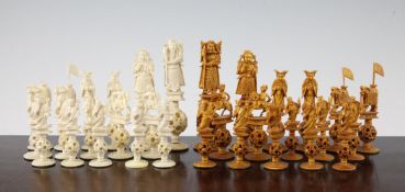 An early 20th century Chinese carved ivory chess set, complete with thirty two pieces, each raised