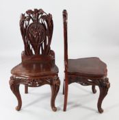 A pair of Japanese lacquered Iris chairs, with floral backs, decorated in the Art Nouveau style with