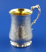 A Victorian silver christening mug, of baluster form, with engraved foliate scroll and strapwork