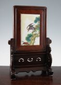 A Chinese porcelain and rosewood table screen, first half 20th century, the porcelain plaque painted