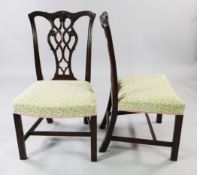 A set of ten mahogany Chippendale style dining chairs, two with arms, eight singles, with pierced