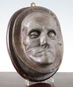 A 20th century oval bronze death mask, of an elderly lady titled `Lady Clannfhearghuis of Stra-