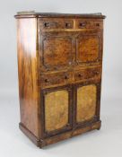 A Victorian burr walnut escritoire, with three quarter brass gallery, the single drop down door