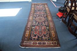 A Shirvan runner, with four polygons in a field of animals and geometric motifs, on a dark blue