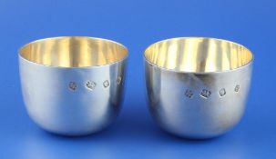 A pair of 1970`s silver tumbler cups by C.F. Hancock & Co, London, 1971, height 2.25in, 10 oz.