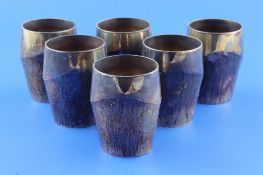 A stylish set of six early 1960`s silver beakers by the Royal College of Art, of shaped