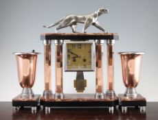 Attributed to Michel Decoux. An Art Deco marble, chrome and copper three piece clock garniture,