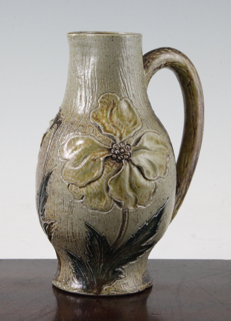 A Martin Brothers stoneware baluster jug, c.1880, modelled with delicately petalled flowers and