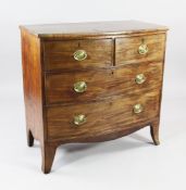 An early 19th century mahogany bowfront chest, of two short and two long drawers, on splayed bracket