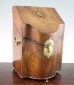 A George III mahogany serpentine shape knife box, with chequer banded borders and swing brass side