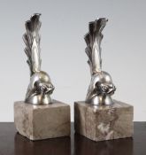 Gaston Rischmann. A pair of French Art Deco silvered metal bookends, modelled a comical birds on