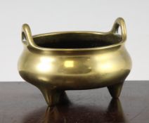 A Chinese bronze ding censer, Xuande mark, 18th century or earlier, of compressed globular form with