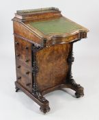 A Victorian burr walnut and marquetry inlaid davenport, with serpentine gilt tooled leather inset