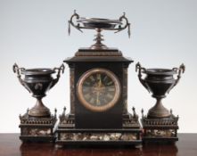 A Victorian black slate and marble three piece clock garniture, with urn surmount and side