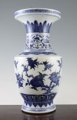 A Chinese blue and white baluster vase, painted with fruiting branches, flower and foliate and