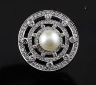 A 1980`s 18ct white gold, diamond and cultured pearl set target brooch, of openwork design, 1in.