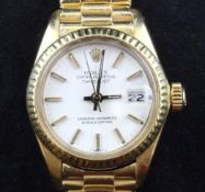 A lady`s early 1980`s 18ct gold Rolex Oyster Perpetual Datejust wrist watch, the white dial with