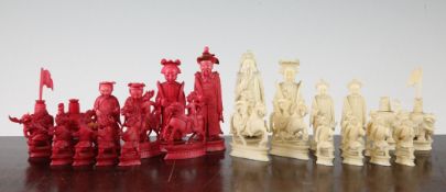 An early 20th century Canton red stained and natural ivory chess set, complete with thirty two