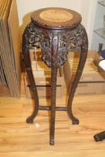 A Chinese rosewood urn stand, with circular rouge marble inset top, bamboo carved and pierced