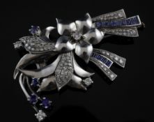 A 1960`s? Art Deco style white metal, synthetic sapphire and diamond set spray brooch, set with