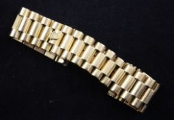 A gentleman`s 18ct gold Rolex Presidential watch bracelet, with two spare links, 71 grams.