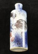 A Chinese underglaze blue and copper red `dragon` cylindrical snuff bottle, 1800-1900, the copper