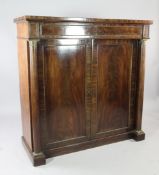 A large early 19th century mahogany ormolu mounted side cabinet, fitted a single drawer over two