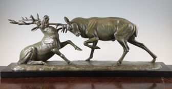 Irenee Rochard (1906-1984). A patinated metal group depicting a stag fight, signed and mounted on