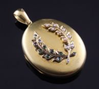 A Victorian gold gem and seed pearl set pendant locket, with applied leaf motifs, gross 24.8
