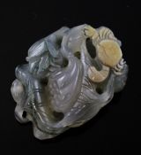 A Chinese agate carving of a crab crawling on lotus, the grey stone with green dendritic inclusions,