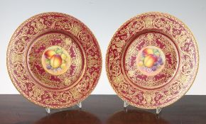 A pair of Royal Worcester fruit painted plates, post-war, each painted to the centre by Telford with
