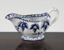 A Bow blue and white sauce boat, c.1764-68, with a moulded gadrooned rim and shaped fruits,