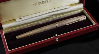 A 1970`s engine turned 9ct gold Parker fountain pen, in leather case.