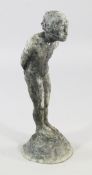 A lead garden statue of a young child, standing on a rocky base, c.1900, H.2ft 4.5in.