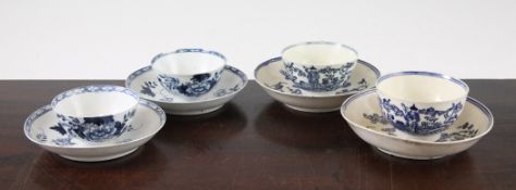 Two 18th century English porcelain `Bird on a Branch` pattern tea bowls and saucers, possibly