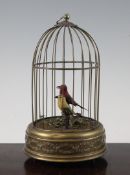 A 20th century Reuge singing bird automaton, modelled as two birds within a wire cage, on a circular