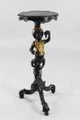 An Italian late 19th / early 20th century ebonised and painted carved torchere stand, the serpentine