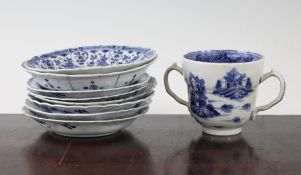 A Chinese blue and white cup and eight saucer dishes, 17th / 18th century, comprising a Kraak dish