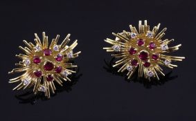 A pair of early 1960`s 18ct gold, ruby and diamond set ear clips, of flower head design, gross 18.