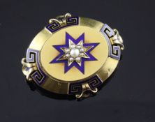 A mid Victorian gold, blue enamel and seed pearl set oval locket, with Greek key decoration and
