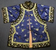 A Chinese embroidered silk lady`s summer robe, early 20th century, decorated with butterflies on a