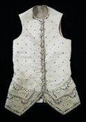 A fine cream silk George III gentleman`s waistcoat, possibly a wedding waistcoat, hand embroidered