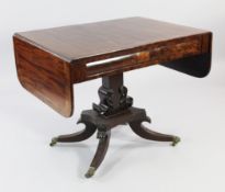 A Regency mahogany sofa table, with cushion frieze drawers opposing dummy drawers, on a central